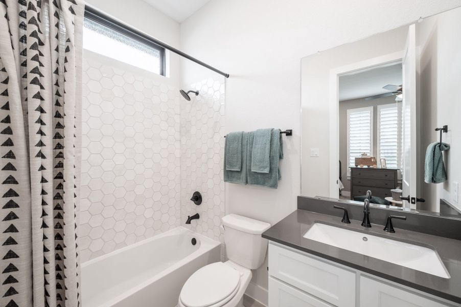 Representative furnished interior of a home built from the Carignan by Tri Pointe Homes in Sienna 80′, Missouri City (Image 44).