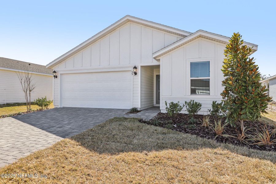 Front exterior of a new home in Colbert Landings, Palm Coast, FL, highlighting curb appeal (Image 23).