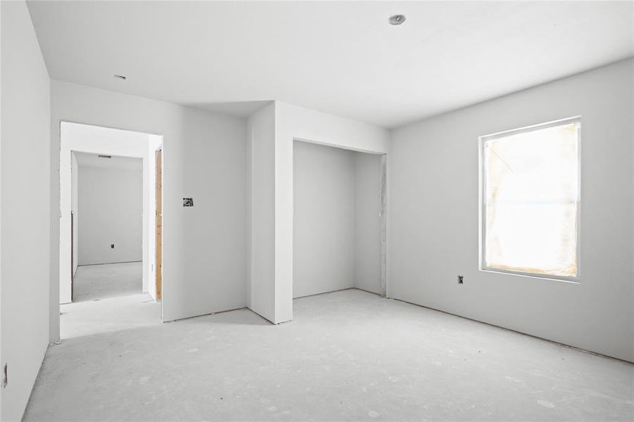 Interior room with white walls and an unfinished concrete floor