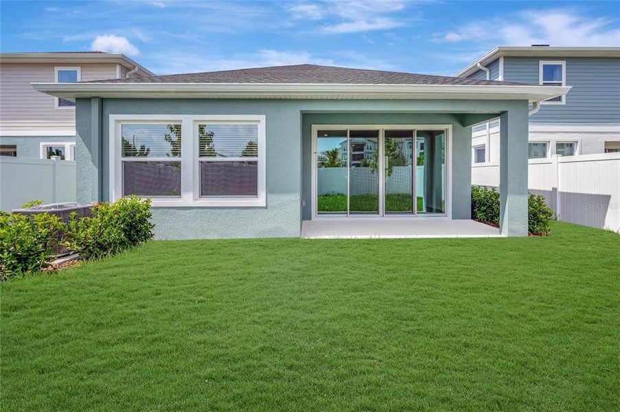 Exterior details and patio area of a home in Chapel Crossings - Garden Series, Wesley Chapel (Image 14).