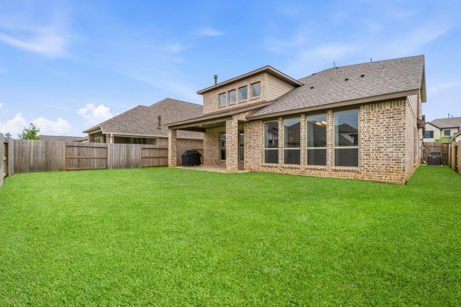 The spacious, fully fenced backyard offers plenty of room for outdoor entertaining, play, pets, or even a future pool. *VIRTUALLY ENHANCED