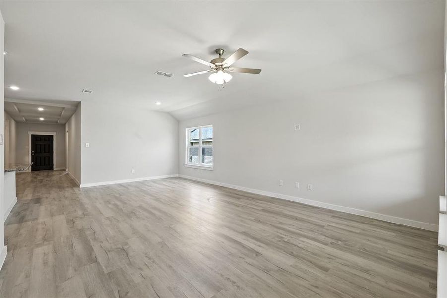 Unfurnished living room featuring light wood finished floors, recessed lighting, and a ceiling fan