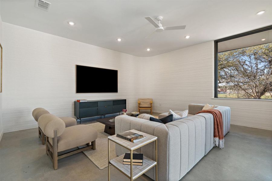 Living room featuring ceiling fan