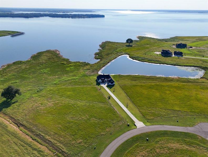 Aerial overview of property's location featuring a large body of water Aerial overview of property's location featuring a large body of water