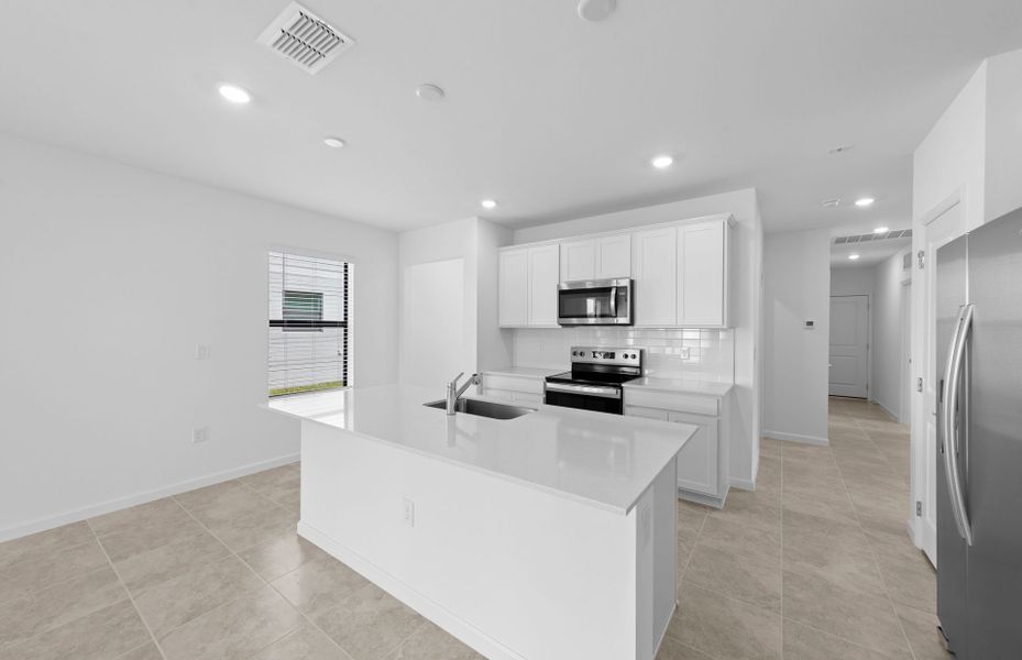 Furnished interior view inside a new home in Caloosa Cove, Labelle (Image 17).