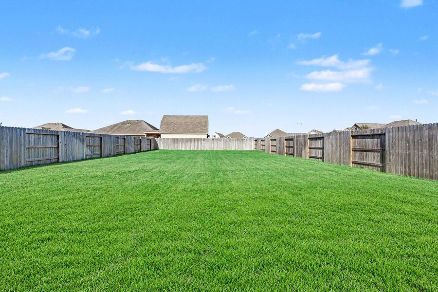 Huge backyard perfect for outdoor activities and privacy.