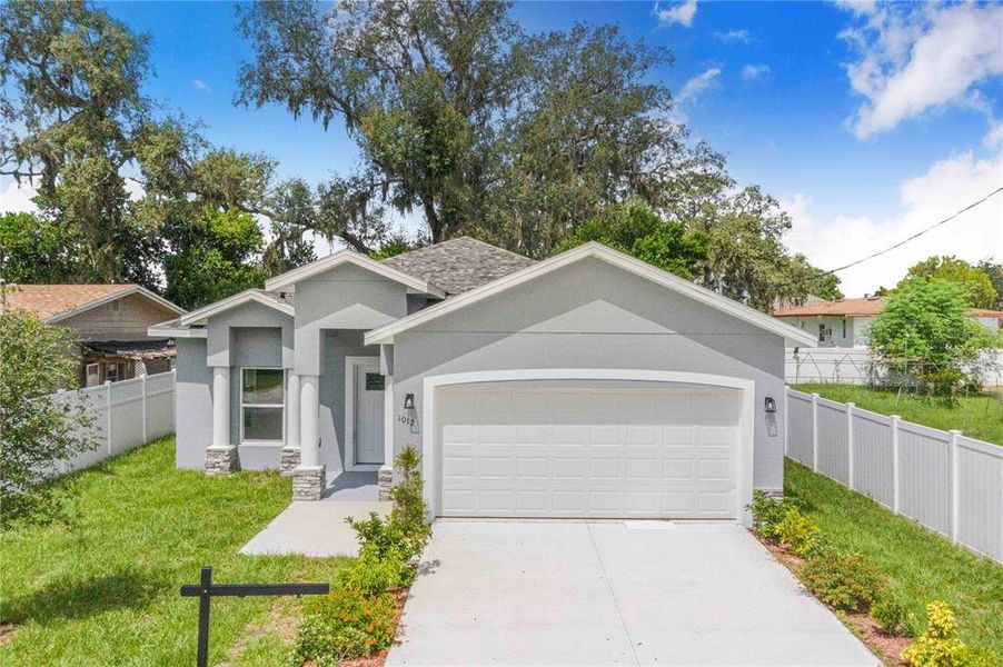 Front exterior of a new home in , Haines City, FL, highlighting curb appeal (Image 1).