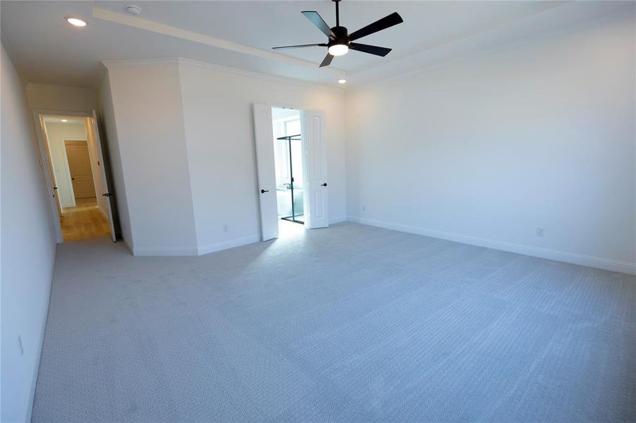 Unfurnished bedroom featuring ornamental molding, carpet, a ceiling fan, and recessed lighting Unfurnished bedroom featuring ornamental molding, carpet, a ceiling fan, and recessed lighting