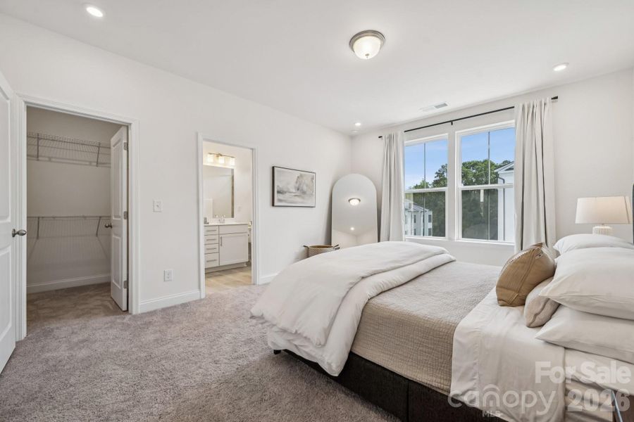 Primary suite has large walk-in closet and ensuite bath