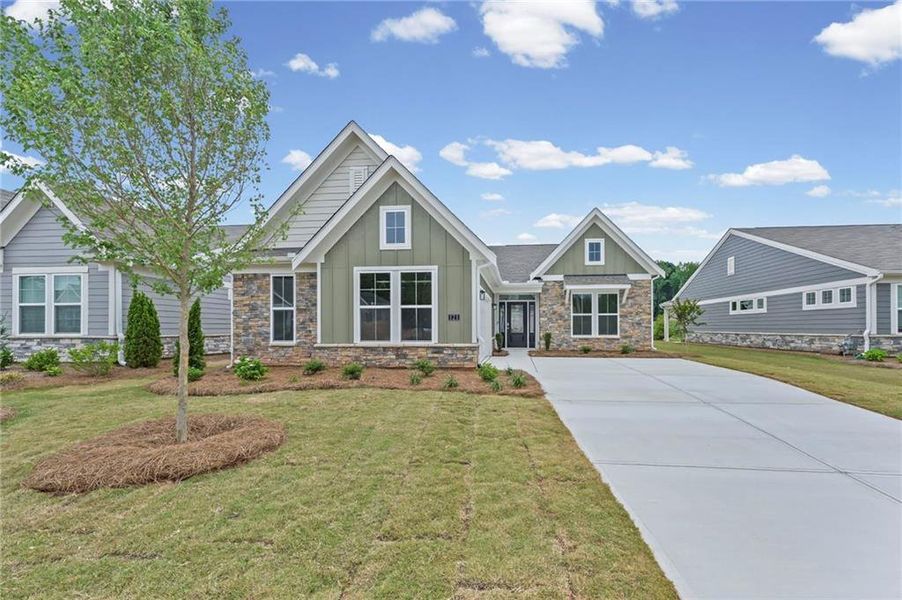 Front exterior of a new home in Laurel Farms, Dallas, GA, highlighting curb appeal (Image 20). Front exterior of a new home in Laurel Farms, Dallas, GA, highlighting curb appeal (Image 20).
