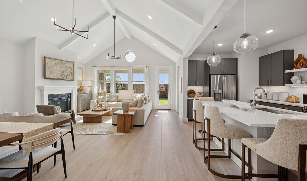 Great room with vaulted ceiling & white ceiling beams