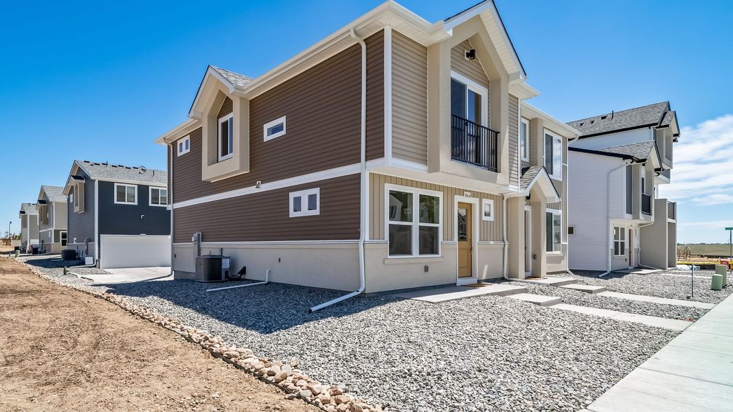 Front exterior of a new home in Banning Lewis Ranch - New Homes Colorado Springs, Colorado Springs, CO, highlighting curb appeal (Image 2). Front exterior of a new home in Banning Lewis Ranch - New Homes Colorado Springs, Colorado Springs, CO, highlighting curb appeal (Image 2).