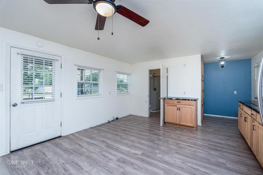 Kitchen featuring light hardwood / wood-style flooring and ceiling fan