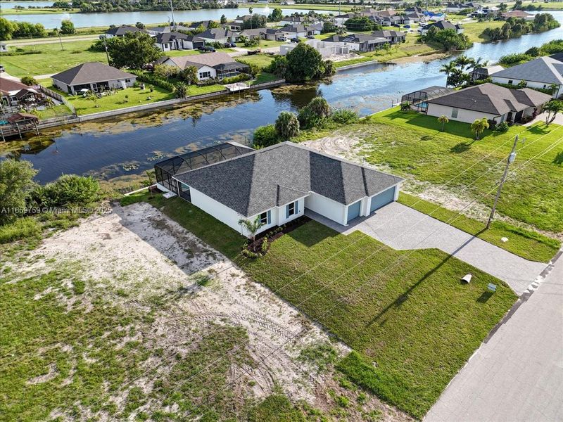 Front exterior of a new home in Cape Coral, Cape Coral, FL, highlighting curb appeal (Image 18).
