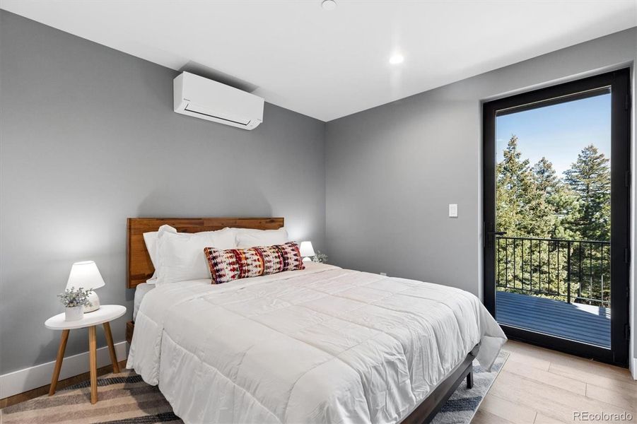 Upper-level suite bedroom with private deck Upper-level suite bedroom with private deck