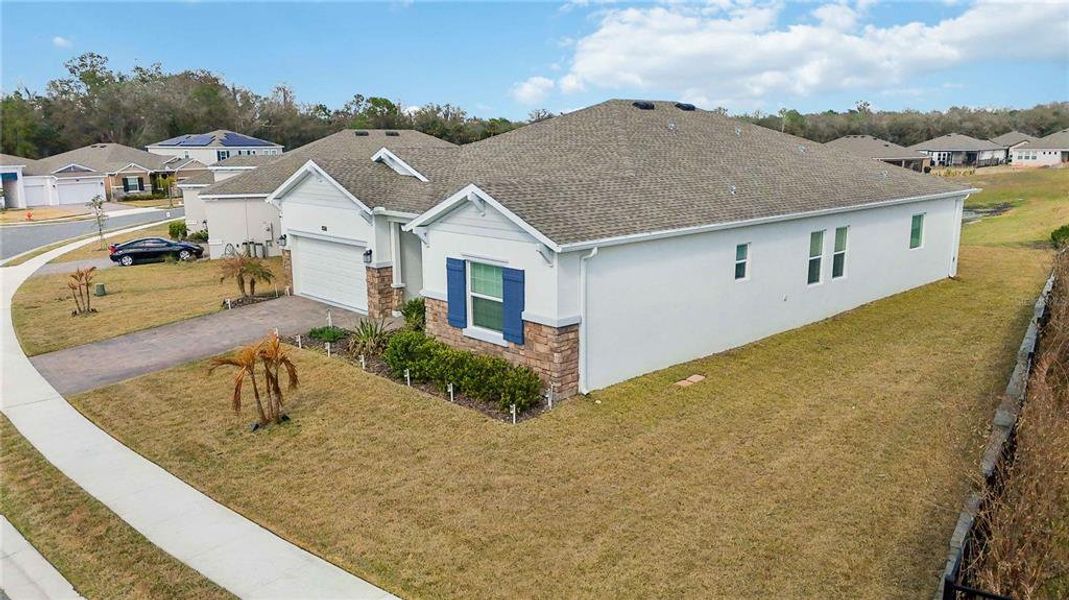 Front exterior of a new home in Providence, Davenport, FL, highlighting curb appeal (Image 23).