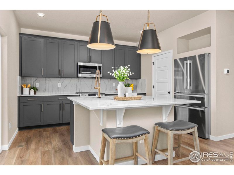 Kitchen with 42 Inch Cabinetry and Quartz Countertops