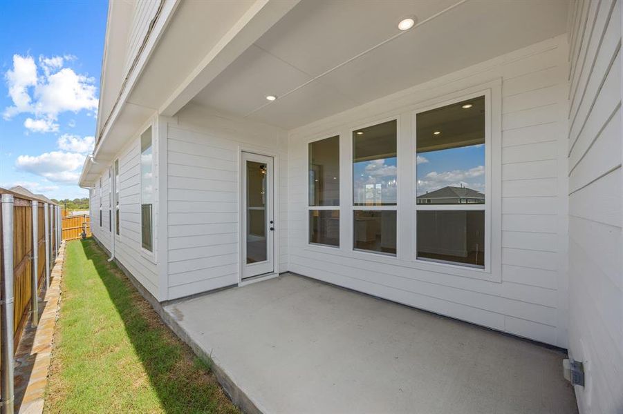 Exterior details and patio area of a home in The Heights at Uptown Celina, Celina (Image 3).