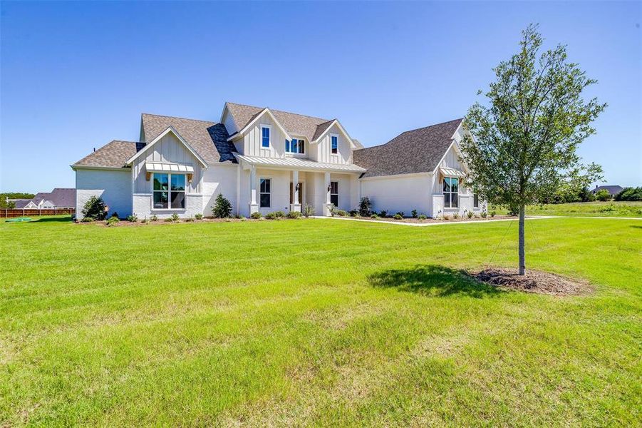 View of front of house with a front yard