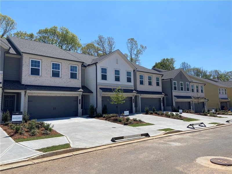 Front exterior of a new home in Eastlyn Crossing, Flowery Branch, GA, highlighting curb appeal (Image 2). Front exterior of a new home in Eastlyn Crossing, Flowery Branch, GA, highlighting curb appeal (Image 2).