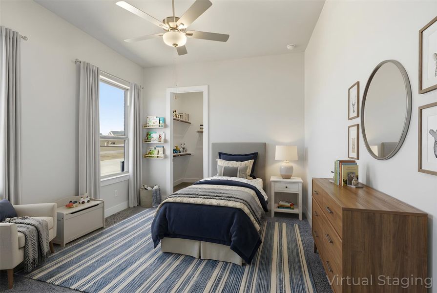Carpeted bedroom featuring ceiling fan and baseboards