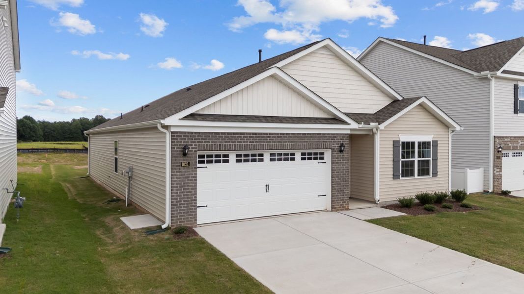 Front exterior of a new home in Saddlebrook, Rocky Mount, NC, highlighting curb appeal (Image 2).