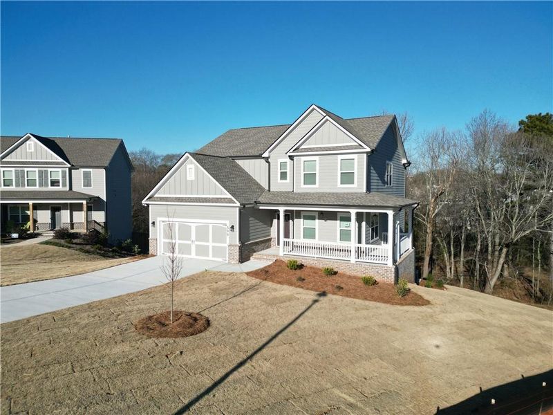 Front exterior of a new home in Calgary Downs, Winder, GA, highlighting curb appeal (Image 13).