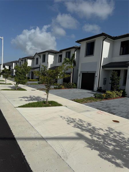 Front exterior of a new home in , Homestead, FL, highlighting curb appeal (Image 7). Front exterior of a new home in , Homestead, FL, highlighting curb appeal (Image 7).