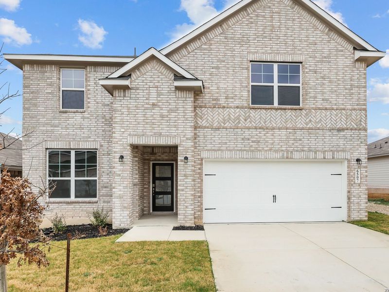 Front exterior of a new home in Royal Crest, San Antonio, TX, highlighting curb appeal (Image 2). Front exterior of a new home in Royal Crest, San Antonio, TX, highlighting curb appeal (Image 2).