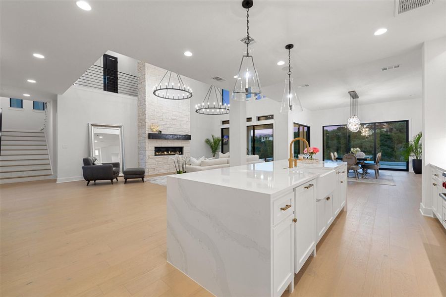 The kitchen offers a captivating vantage point, overlooking the living and dining areas, creating an open and inviting space perfect for entertaining