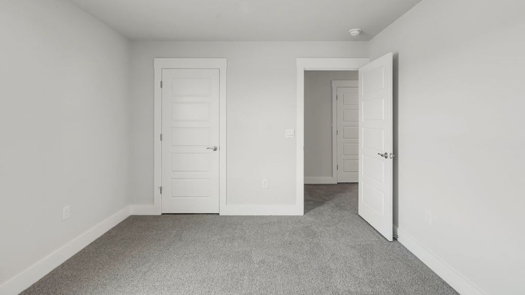 Spacious, unfurnished interior of a new home in Sidbury Station, Castle Hayne (Image 34).