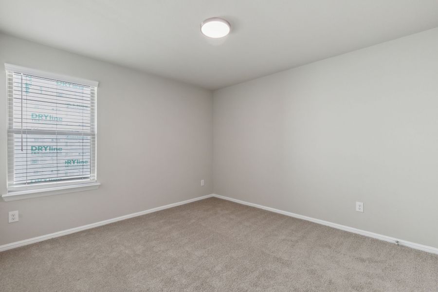 Bedroom in the Harrison home plan by Trophy Signature Homes – REPRESENTATIVE PHOTO Bedroom in the Harrison home plan by Trophy Signature Homes – REPRESENTATIVE PHOTO