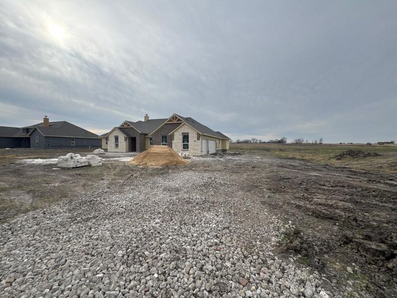 View of front of house featuring a chimney and brick siding View of front of house featuring a chimney and brick siding