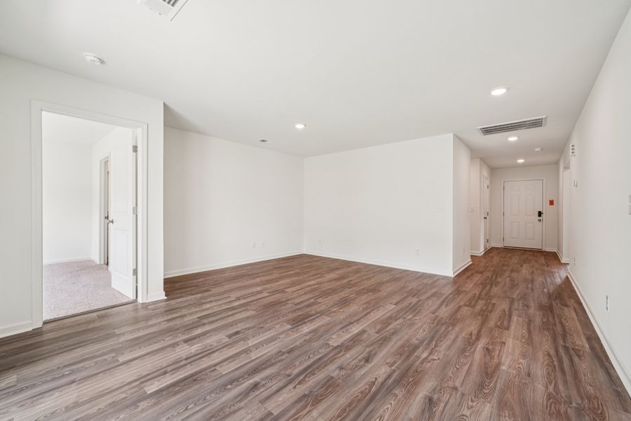 A room with wood floors. A room with wood floors.