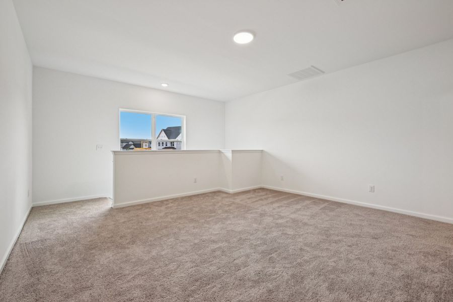 Representative unfurnished interior of a home built from the Macon by Ashton Woods in Rowland's Grant, Fuquay Varina (Image 45).