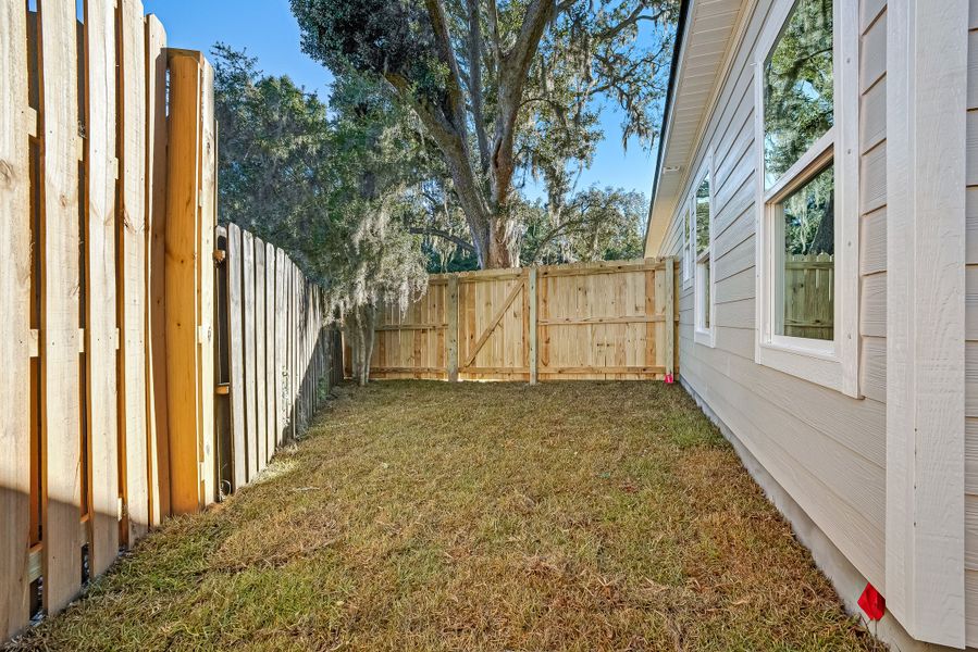 Exterior details and patio area of a home in Live Oak Cottages, Freeport (Image 29).