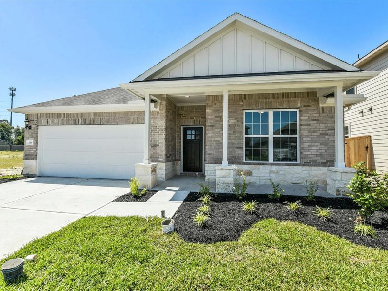 Front exterior of a new home in Sundance Cove, Crosby, TX, highlighting curb appeal (Image 2).