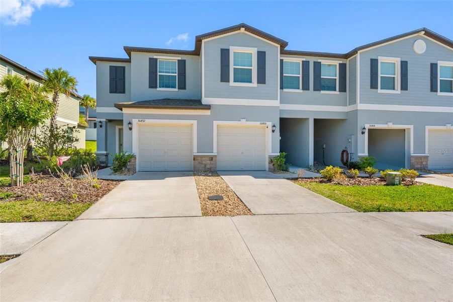 Front exterior of a new home in , Zephyrhills, FL, highlighting curb appeal (Image 22).