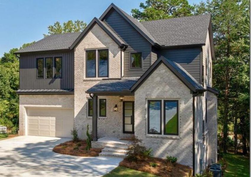 Front exterior of a new home in , Cumming, GA, highlighting curb appeal (Image 31). Front exterior of a new home in , Cumming, GA, highlighting curb appeal (Image 31).
