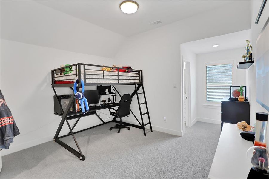 White-painted interior room with gray carpet flooring