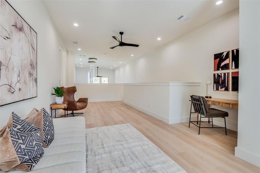 Sitting room featuring light wood finished floors, recessed lighting, and ceiling fan
