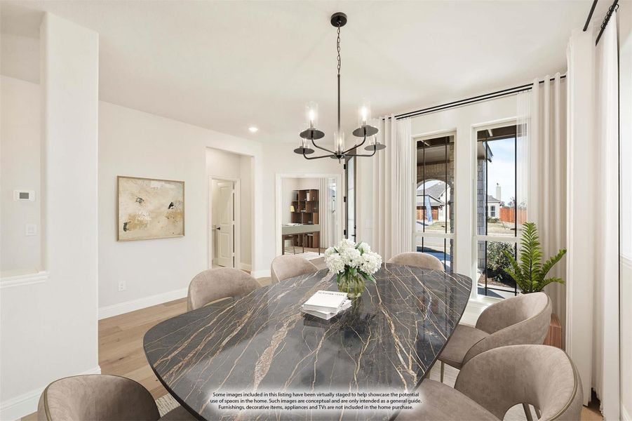 Dining room with oval marble table, upholstered chairs, and black chandelier near large windows
