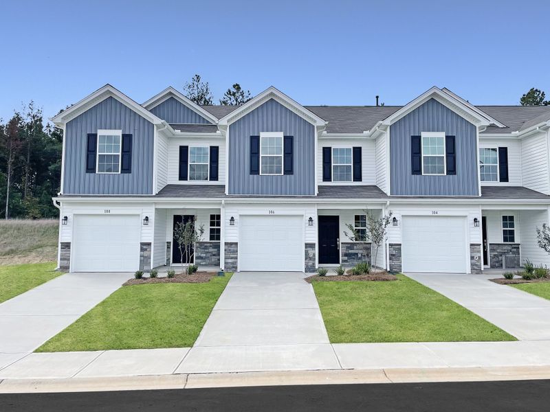 Front exterior of a new home in Springdale Towns, Clinton, SC, highlighting curb appeal (Image 1).