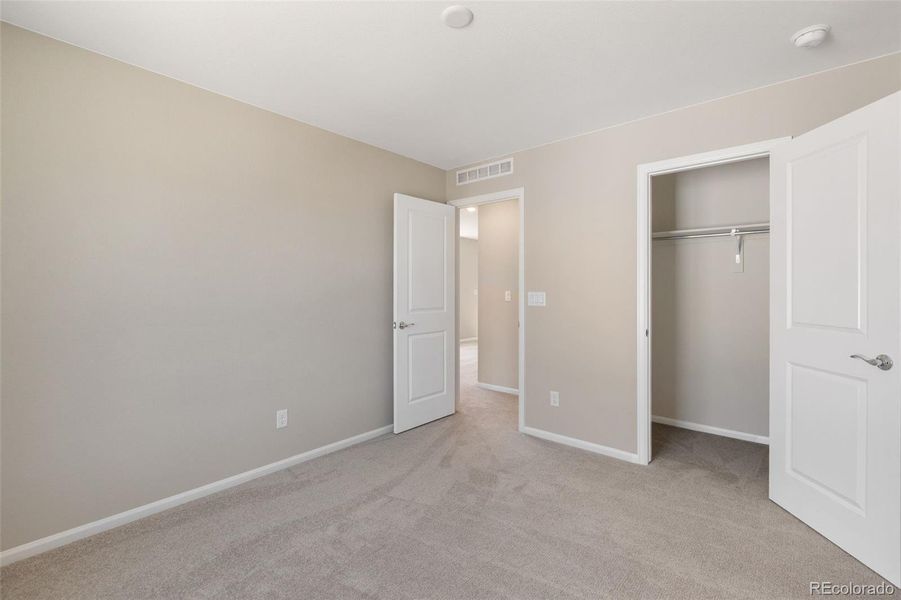 Spacious, unfurnished interior of a new home in Woodrose at Painted Prairie, Aurora (Image 16).