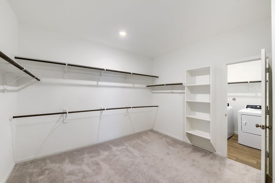 Now this is a primary closet with laundry access