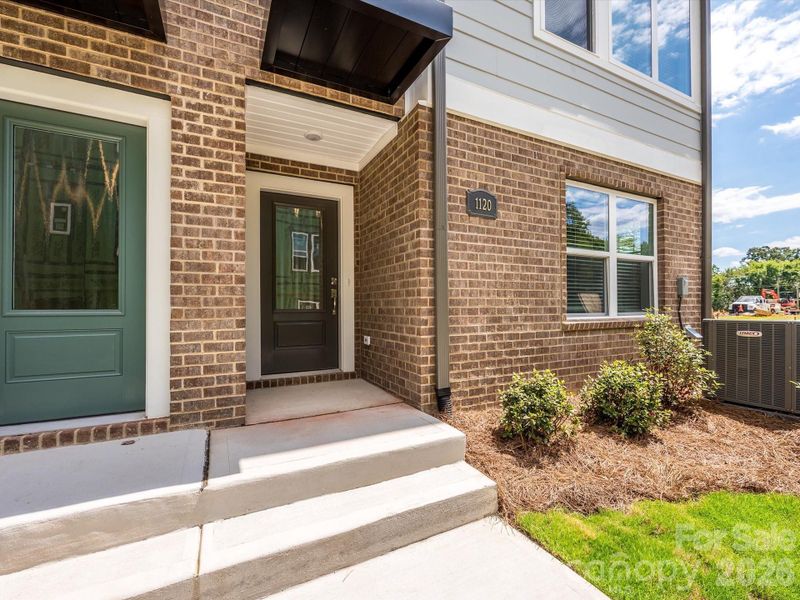 Exterior details and patio area of a home in Central Living at Craig, Charlotte (Image 21).