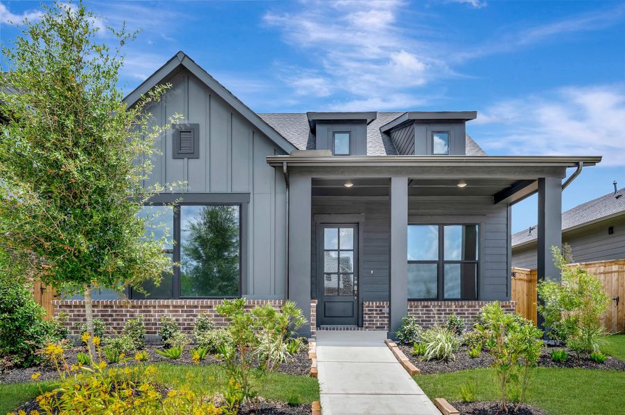 Front exterior of a new home in Sienna - Landmark Row Collection, Missouri City, TX, highlighting curb appeal (Image 1). Front exterior of a new home in Sienna - Landmark Row Collection, Missouri City, TX, highlighting curb appeal (Image 1).