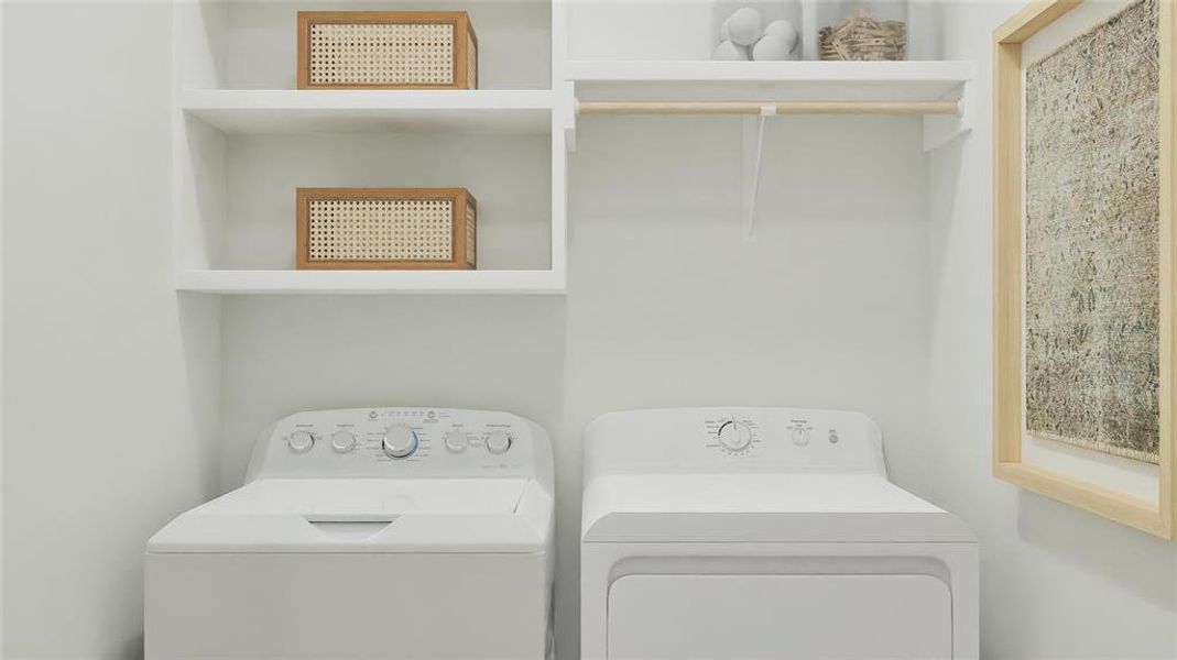 Laundry room featuring washing machine and clothes dryer