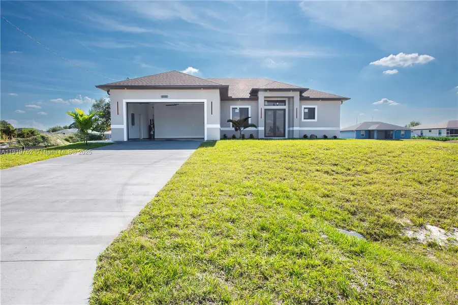 Front exterior of a new home in , Lehigh Acres, FL, highlighting curb appeal (Image 2). Front exterior of a new home in , Lehigh Acres, FL, highlighting curb appeal (Image 2).
