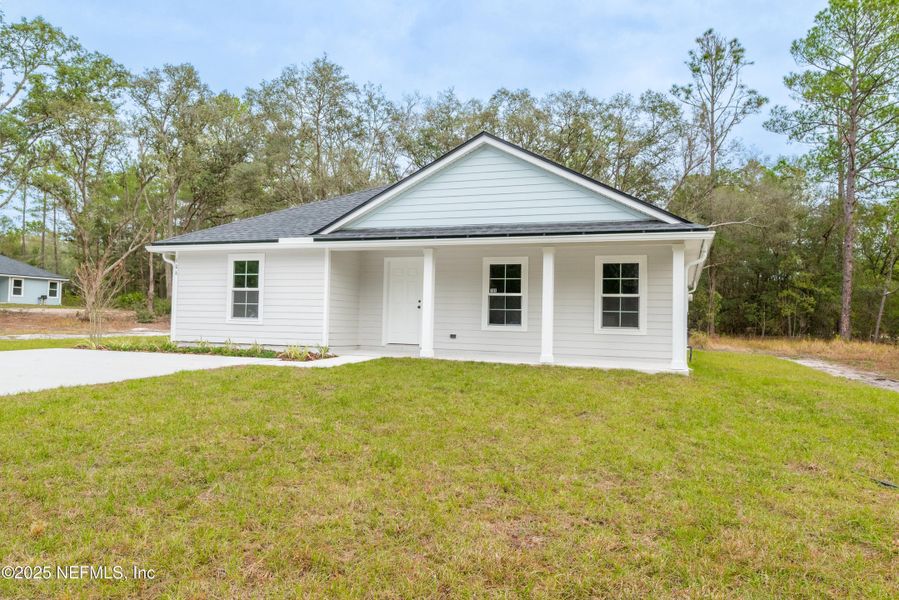 Front exterior of a new home in , Florahome, FL, highlighting curb appeal (Image 18).